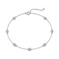 Silver bracelet with small round diamonds on a white background