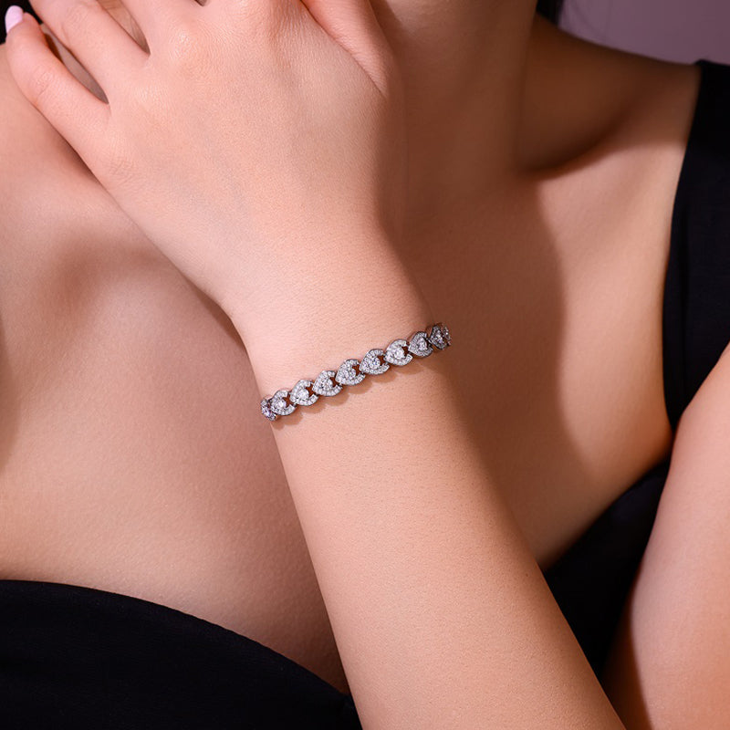 Silver bracelet on a person's wrist with a blurred background
