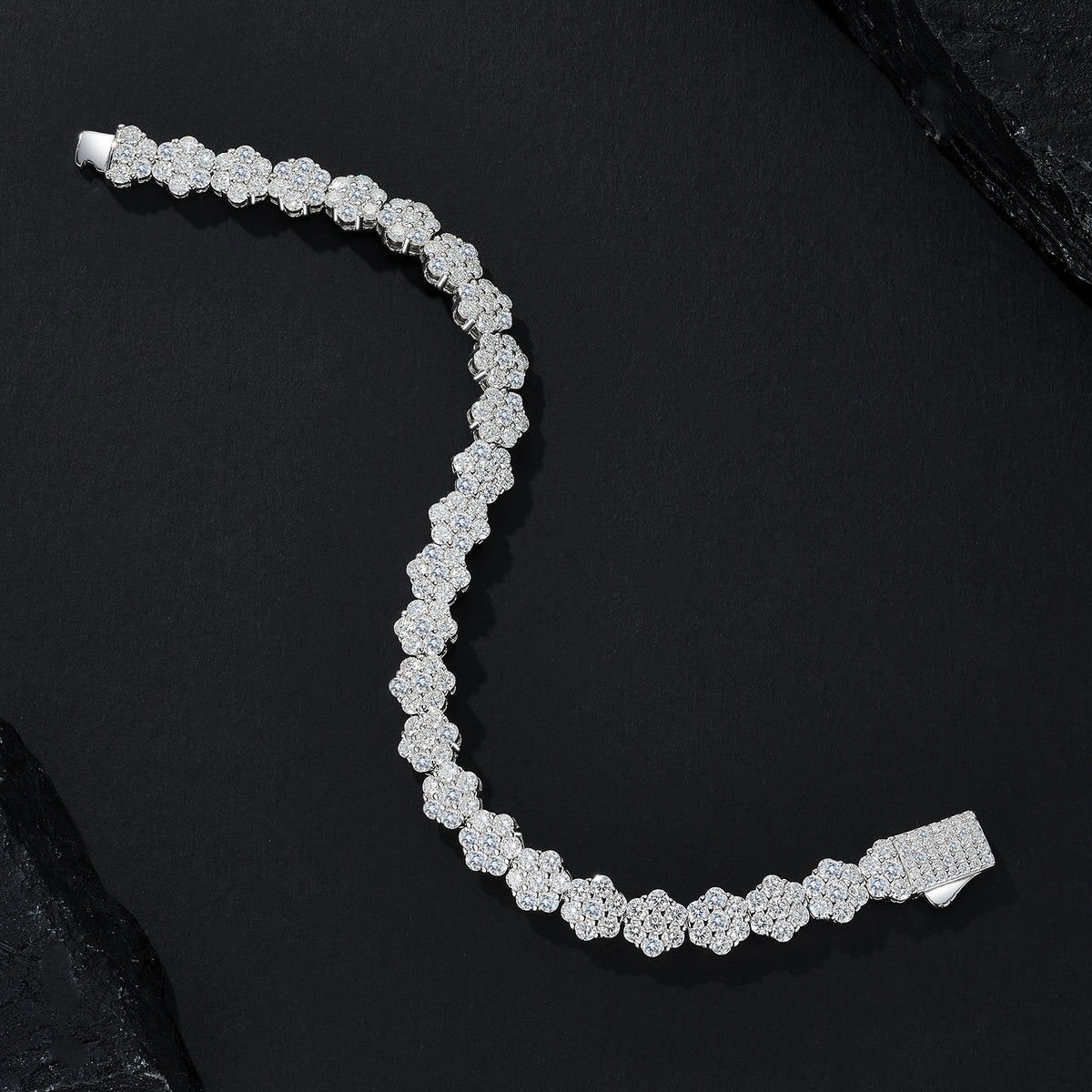 Silver bracelet with diamonds on a black background