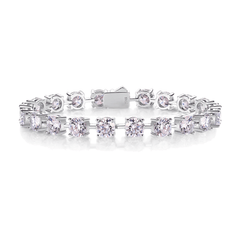 A silver tennis bracelet featuring round-cut clear gemstones in a prong setting, displayed on a clean white background.