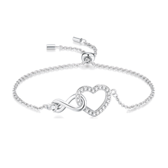 A silver adjustable adjustable bracelet featuring an infinity symbol and a heart-shaped crystal charm, displayed on a clean white background.