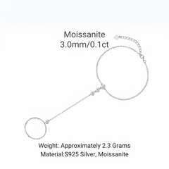 Silver chain bracelet with a circular Moissanite pendant and an adjustable extender chain, shown on a white background with text detailing its weight and materials.