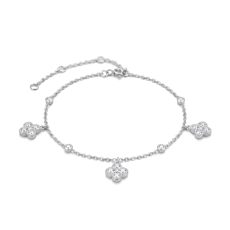 A delicate silver chain bracelet featuring three floral clover motifs set with clear stones, displayed on a clean white background.