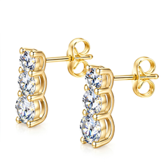 A pair of gold-plated drop earrings featuring three round-cut clear crystals in a curved setting, shown on a clean white background.