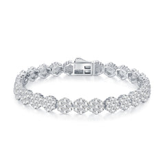 Silver bracelet with clear gemstones on a white background