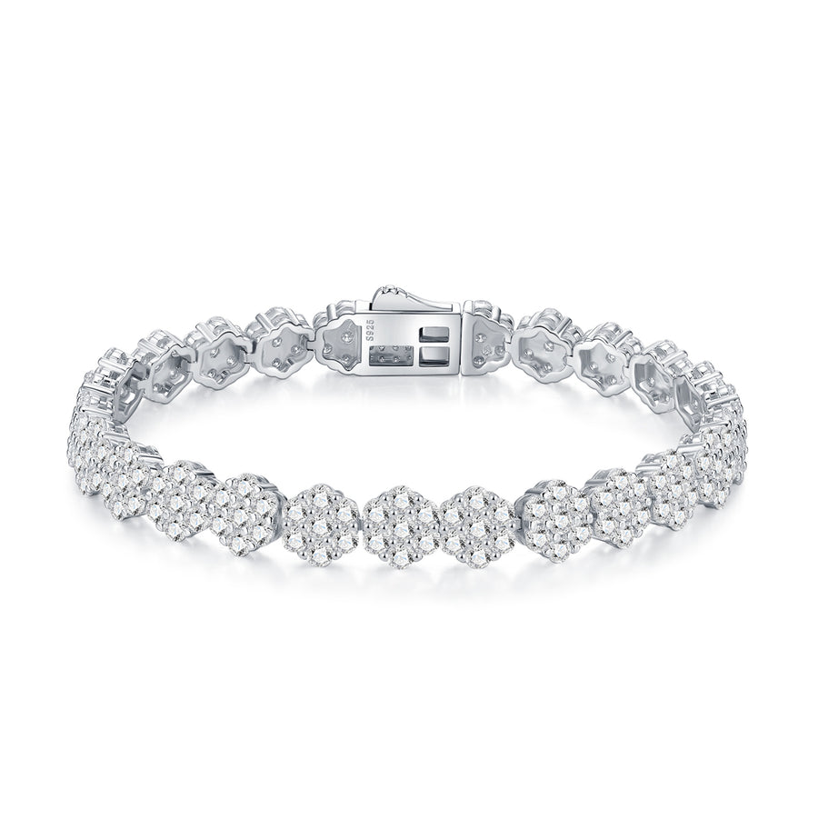 Silver bracelet with clear gemstones on a white background