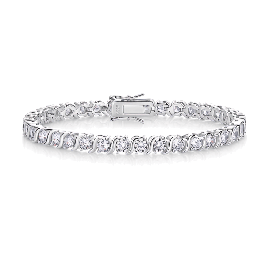 A silver tennis bracelet with round-cut clear gemstones in a prong setting, featuring a clasp closure, shown on a plain white background.