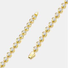 A gold tennis-style bracelet with round clear gemstones in bezel settings, shown on a light gray background with two close product views.